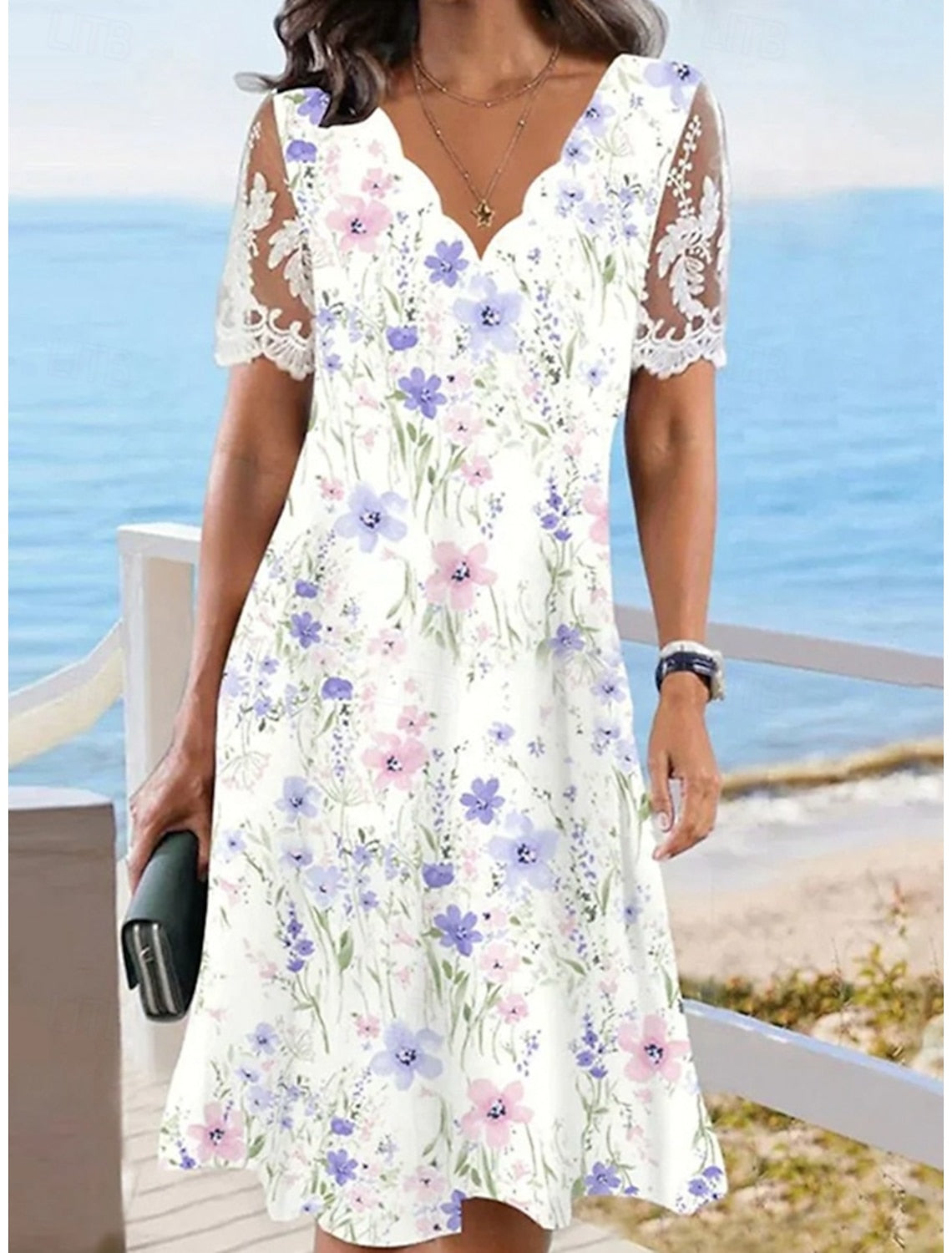 Daniella | Midi-jurk met bloemenprint en kanten mouwen